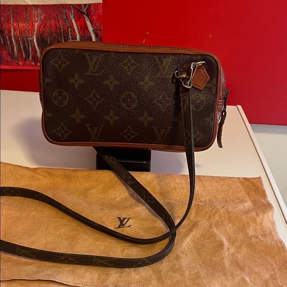 Preowned Louis Vuitton Monogram Marly Bandolier Crossbody Bag with dust bag.